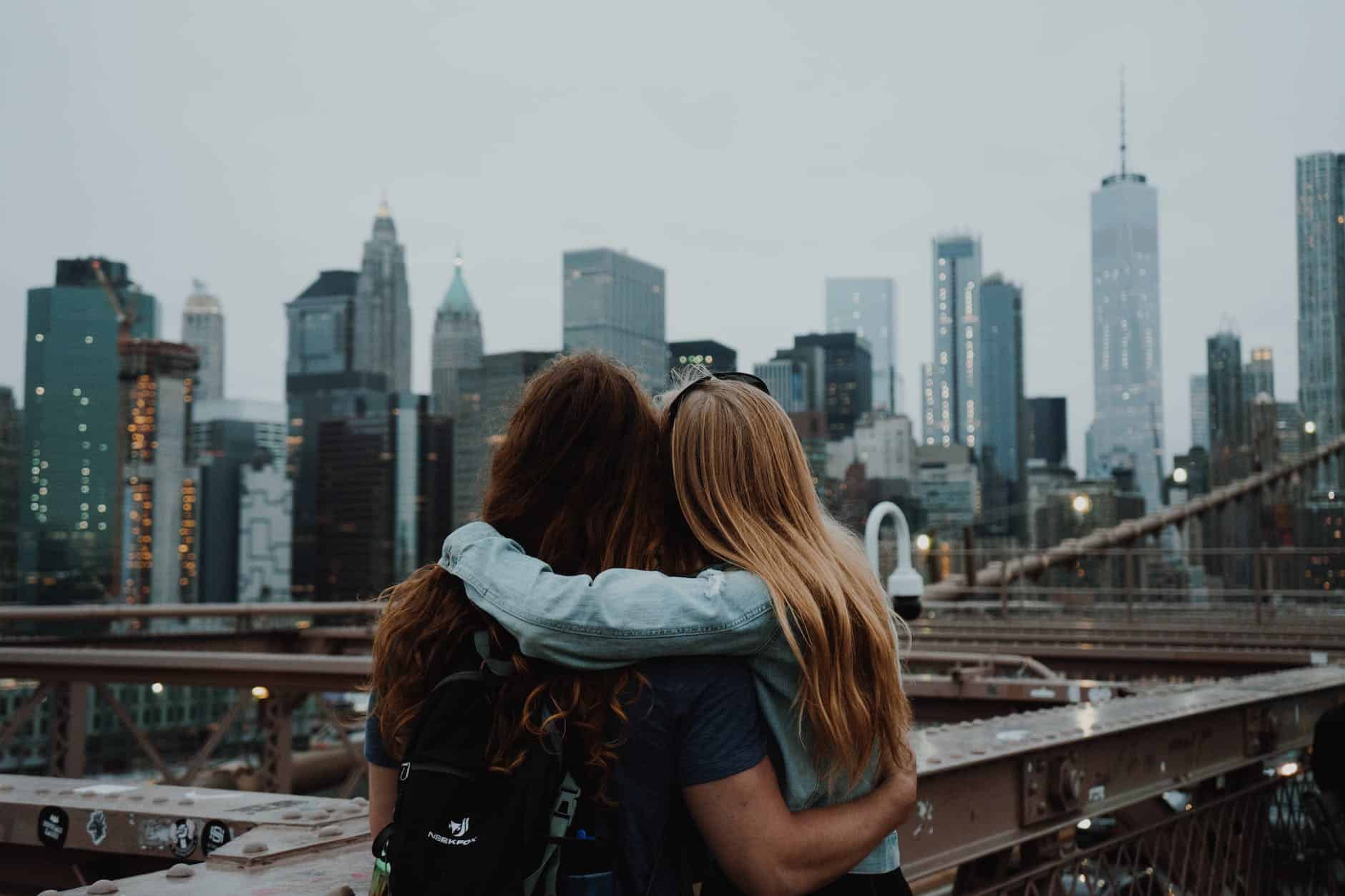 a couple enjoying the view of the new york city skyline