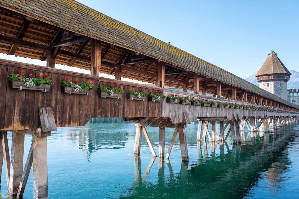 Old Chapel Bridge over river in Lucerne