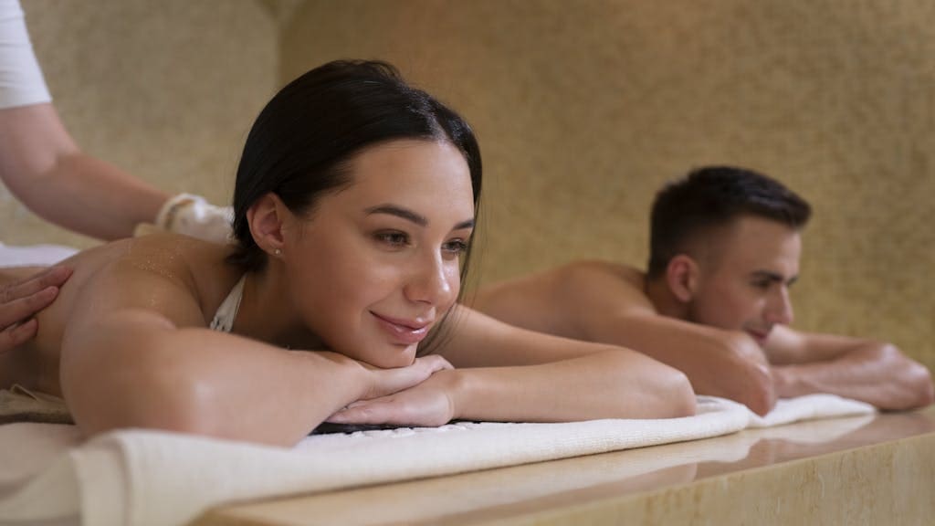 A Couple Receiving a Massage