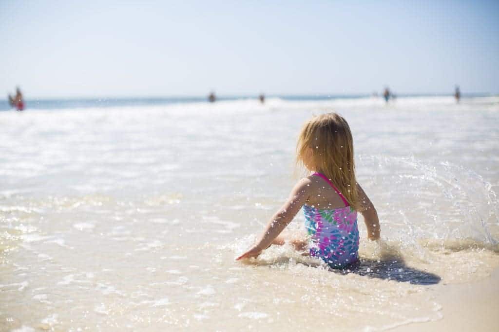 Girl Sitting on Shore