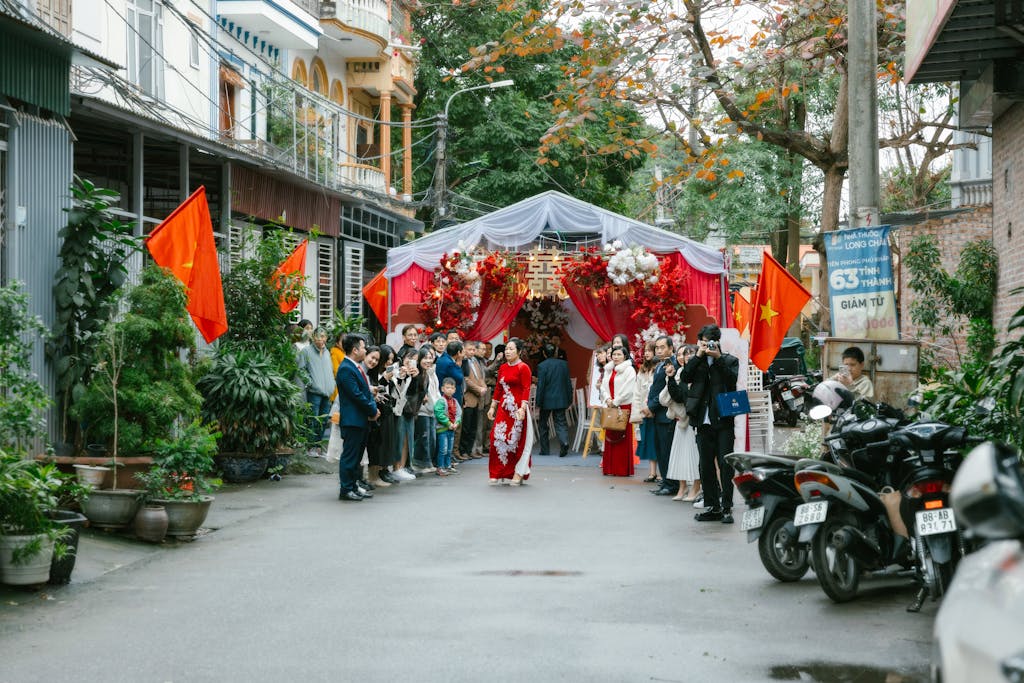 A wedding ceremony in a street with people walking