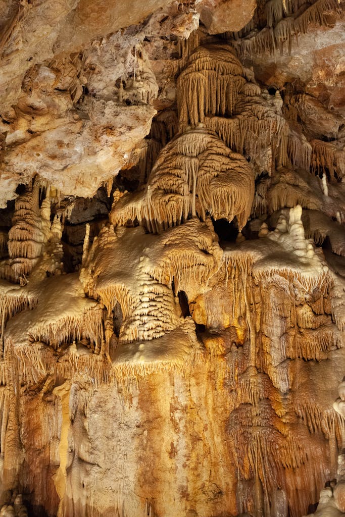 Marvel at the intricate limestone formations in the caves of Meyrueis, France.